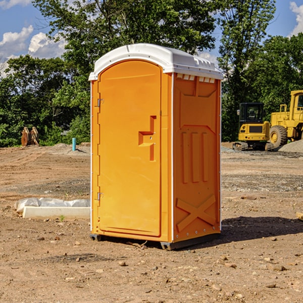 what is the cost difference between standard and deluxe portable restroom rentals in Elmdale